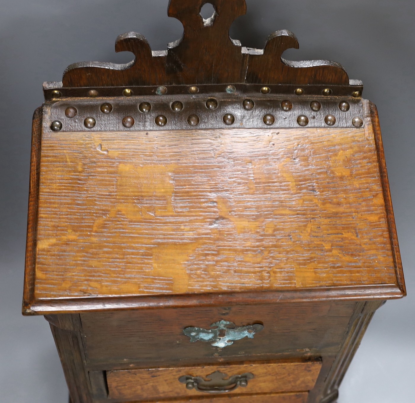 An 18th century and later oak spice cupboard, 53 cms high